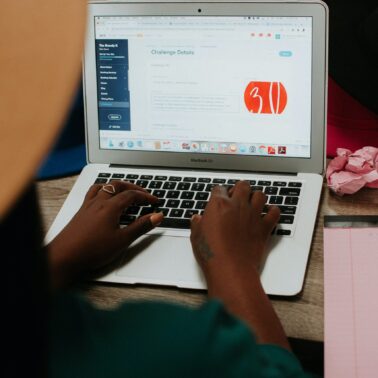 freelancer typing on laptop